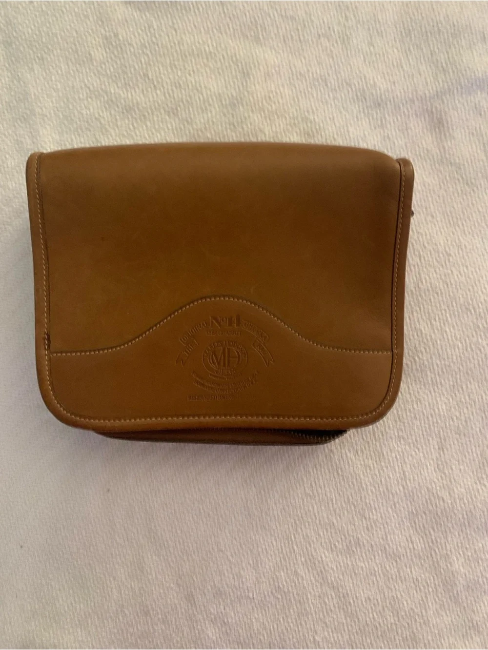 The Sak Brown Leather Garment Bag Panel with Embossed Logo